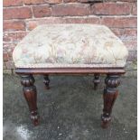 A 19TH CENTURY MAHOGANY UPHOLSTERED STOOL, the needlepoint top above four baluster fluted