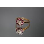 A HALLMARKED 18 CARAT GOLD RUBY AND DIAMOND RING, ring size Q