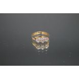 AN 18CT GOLD THREE STONE DIAMOND RING, set with old cut diamonds, the central diamond being approx