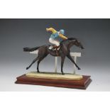 A BORDER FINE ARTS LIMITED EDITION FIGURE OF A RACE HORSE IN FULL FLIGHT, number 540/1500, signed