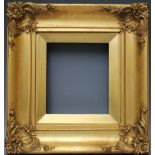 A 19TH CENTURY GOLD SWEPT FRAME WITH INTEGRAL SLIP, frame W 9 cm, slip rebate 23 x 20 cm, frame