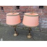 A PAIR OF FRENCH EMPIRE STYLE GILT METAL THREE BRANCH TABLE LAMPS, complete with shades, overall H