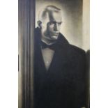 D ASHTON (XX). A portrait study of a man in a doorway, unsigned, oil on canvas, framed, 88 x 63