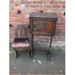 AN UNUSUAL CARVED OAK HERALDIC STYLE CABINET ON STAND, with painted detail to the front, the fall