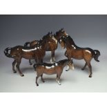 TWO BESWICK SWISH TAIL HORSES, brown gloss, 1st version, model 1182, together with a Beswick Head