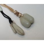 A CHINESE CELADON JADE PENDANT, finely carved in the form of seed pods, H 7 cm, together with a