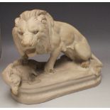 A CLASSICAL ALABASTER STUDY OF A LION, standing above a wild boar, bearing signature to the base '