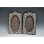 A PAIR OF HALLMARKED SILVER FRAMES BY THE BOOTS PURE DRUG COMPANY - BIRMINGHAM 1905, having