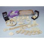 A COLLECTION OF VINTAGE CARVED BONE JEWELLERY ITEMS, to include two bead necklaces, a selection of