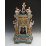 A LARGE ORNATE CONTINENTAL CERAMIC CLOCK, the architectural style case flanked by four female
