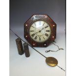 A VICTORIAN POSTMANS ALARM CLOCK, the painted wooden dial with Roman numerals and floral garland,