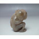 A PALE BROWN JADE CARVING OF A MONKEY, finely carved detail, H 5.3 cm