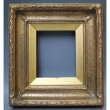 A 19TH CENTURY RIBBED PATTERN GOLD FRAME WITH ACANTHUS LEAF DECORATION, integral gold slip, frame