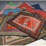 A QUANTITY OF ORIENTAL TEXTILES, comprising a collection of cushion covers having applied decorative