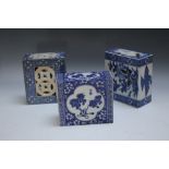 A COLLECTION OF THREE ORIENTAL BLUE AND WHITE CERAMIC PILLOWS, of typical form, one decorated with
