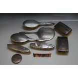 A HALLMARKED SILVER FIVE PIECE DRESSING TABLE SET, together with a pair of silver backed brushes,
