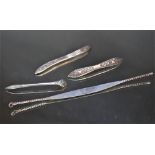 THREE ORIENTAL SILVER TONG SCRAPER TYPE IMPLEMENTS, together with an unmarked example a/f (4)