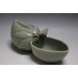 A CHINESE TYPE CELADON WATER DROPPER BRUSH WASH, featuring a bird on a piece of fruit, W 16 cm