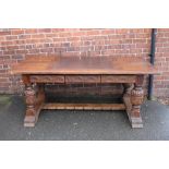 A JACOBEAN STYLE OAK LIBRARY TYPE TABLE, the rectangular top with a smaller central inset leather