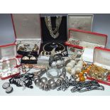 A LARGE COLLECTION OF VINTAGE COSTUME JEWELLERY, comprising various necklace and earring sets,