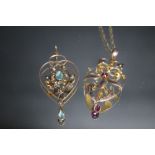 TWO 9CT GOLD EDWARDIAN TYPE PENDANTS, one set with two small pink ruby type stones, the other with