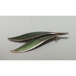 N M THUNE - A NORWEGIAN GREEN GUILLOCHE ENAMEL BROOCH, in the form of leaves overlapping, marked