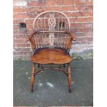 A QUALITY REPRODUCTION OAK HOOP BACKED WINDSOR ARMCHAIR, with pierced splat back, raised on turned