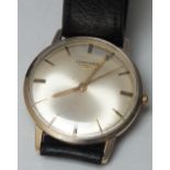 A GENTS 9CT GOLD LONGINES WRISTWATCH, manual wind, champagne dial with hourly baton markers, on