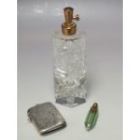 A MINIATURE FLASH CUT PERFUME / SCENT BOTTLE, of torpedo form with gilt mounts, overall L 5.3 cm,