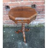 A VICTORIAN ROSEWOOD OCCASIONAL WORK TABLE, the octagonal hinged top opening to reveal a lined
