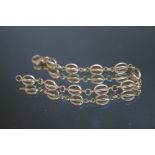 A 9CT GOLD FANCY LINK BRACELET, approx. 9.9 g