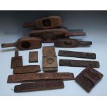 A COLLECTION OF CHINESE TREEN CAKE AND BUTTER MOULDS, in various patterns to include a Chinese