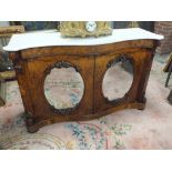 A VICTORIAN WALNUT MARBLE TOPPED CHIFFONIER, of serpentine form, having two oval mirrored panels,