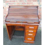 AN EARLY 20TH CENTURY OAK TAMBOUR FRONTED SINGLE PEDESTAL ROLL TOP DESK, the 'S' tambour opening