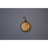 A SOUTH AFRICA 1/10 KRUGERRAND DATED 1988, set in an unmarked yellow metal pendant mount