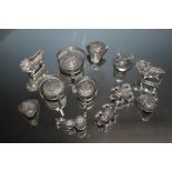 A COLLECTION OF TWELVE CHINESE CHARM TYPE WHITE METAL FIGURES, including animal examples such as a