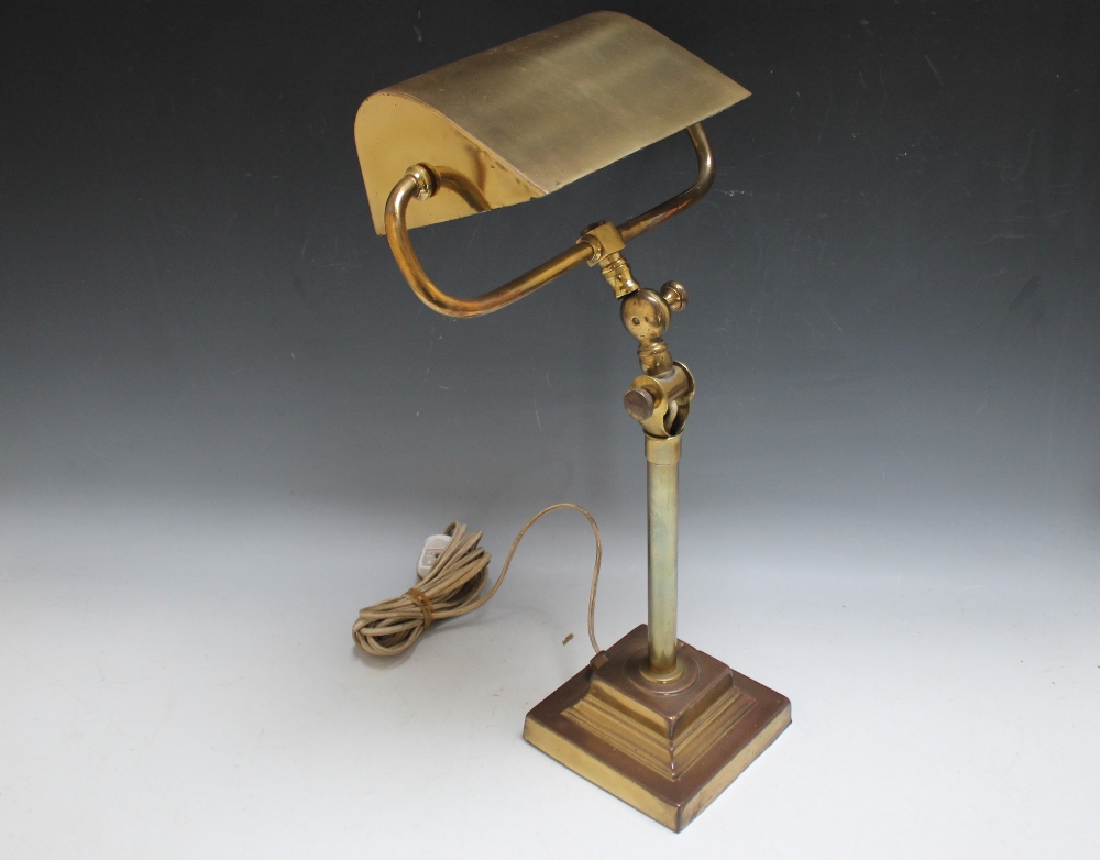 A HEAVY BRASS ADJUSTABLE BANKERS LAMP, on a stepped square base, H 40 cm