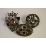 A SCOTTISH THEMED AGATE BROOCH HALLMARKED FOR CHESTER 1912, together with two similar brooches (3)