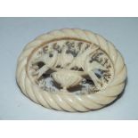 A VICTORIAN DIEPPE CARVED IVORY BROOCH DEPICTING PLINYS DOVES, W 5.3 cm
