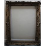 A 19TH CENTURY GOLD SWEPT FRAME, rebate 104 x 76 cm, width of frame 12 cm