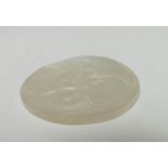 A CHINESE CELADON JADE PLAQUE, finely carved detail depicting fruit and foliage, 5.1 x 4.8 cm