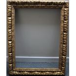 A 19TH CENTURY STYLE CARVED WOODEN GOLD FRAME, rebate 80 x 60 cm, width of frame 9 cm