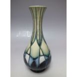 A MOORCROFT STYLISED PATTERN BUD VASE, printed and painted marks to base, H 17 cm
