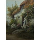 JOSH FISHER (1859-1930). A rural scene with woman standing at the door of a thatched cottage, signed