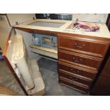 A SEWING CABINET WITH BUILT IN SEWING MACHINE