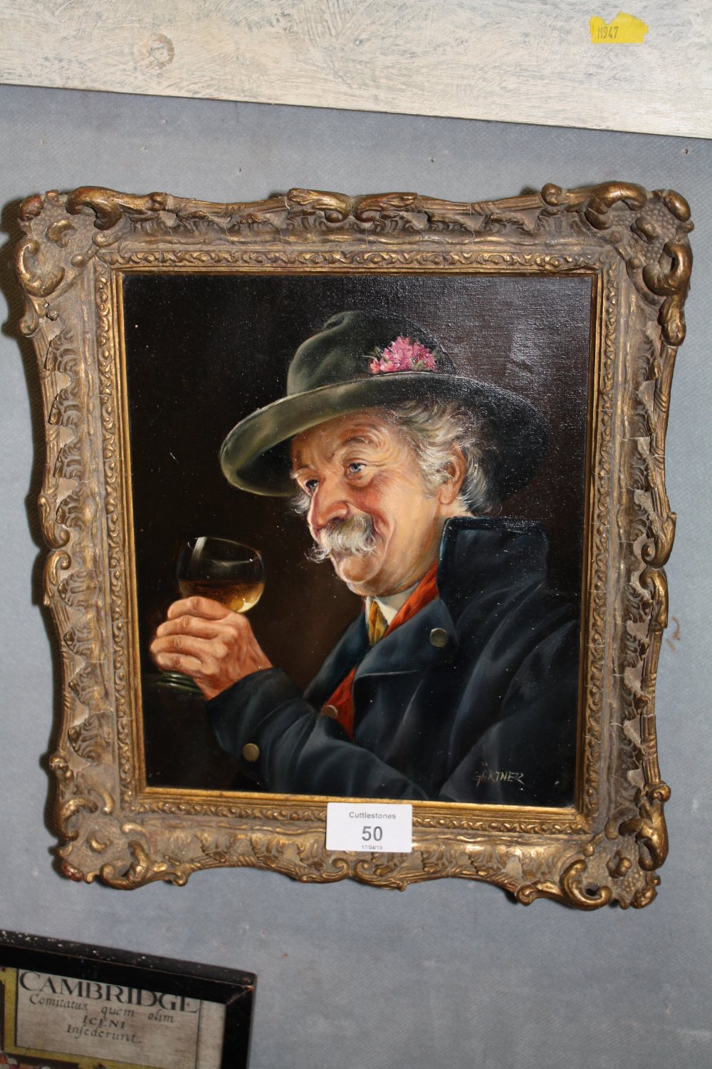 A GILT FRAMED OIL ON BOARD PORTRAIT STUDY OF A GENTLEMAN WITH A GLASS OF WINE ENTITLED 'GERMAN