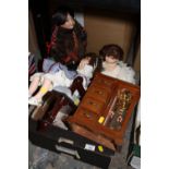 A BOX OF PORCELAIN HEADED DOLLS, TOGETHER WITH A SMALL JEWELLERY CABINET