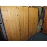 A PAIR OF MODERN PINE DOUBLE WARDROBES (2)