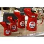 A SET OF FOUR MODERN GRADUATED MOBIL GAS OIL JUGS