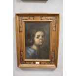 AN UNSIGNED OIL ON CANVAS PORTRAIT STUDY OF A YOUNG FIGURE IN PAINTED GILT FRAME